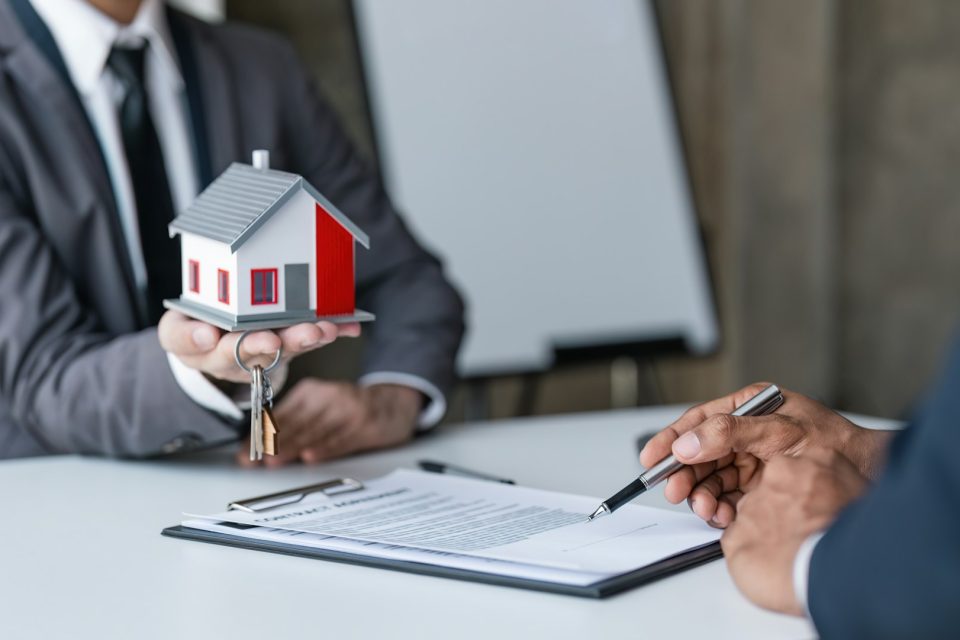 Real estate broker agent presenting and consult to customer to decision making sign insurance form